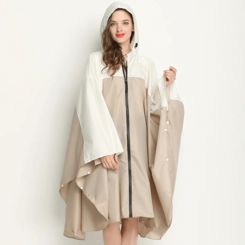 Elegant women's raincoat-poncho with zipper and hood, made of waterproof polyester. Perfect for rainy days, style SF1982.